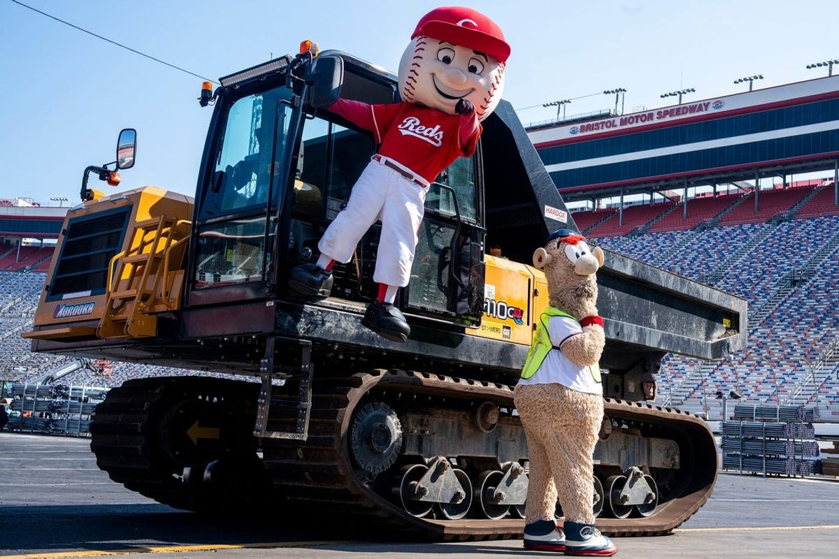 Mascots Mr. Red, left, and Blooper, right, pose for photos during a media event at Bristol Motor Speedway on June 24, 2025, ahead of the MLB Speedway Classic game between the Atlanta Braves and the Cincinnati Reds held at the racetrack.