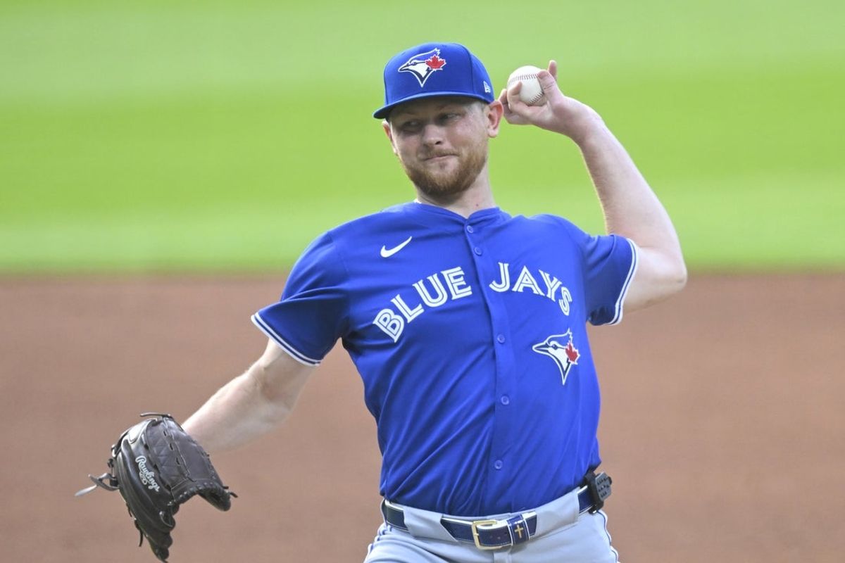 Jun 24, 2025; Cleveland, Ohio, USA; Toronto Blue Jays starting pitcher Eric Lauer (56) delivers a pitch in the first inning against the Cleveland Guardians at Progressive Field. Mandatory Credit: David Richard-Imagn Images