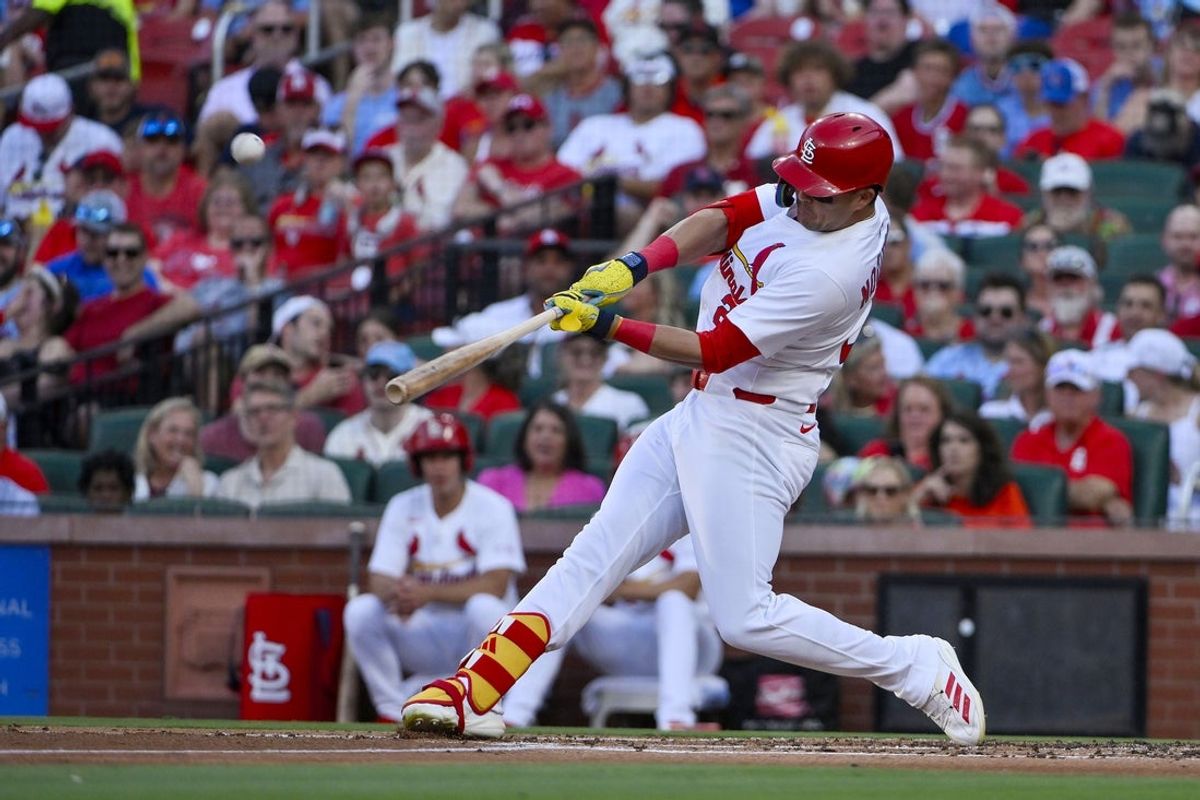 Jun 24, 2025; St. Louis, Missouri, USA;  St. Louis Cardinals left fielder Lars Nootbaar (21) hits a two run home run against the Chicago Cubs during the second inning at Busch Stadium. Mandatory Credit: Jeff Curry-Imagn Images