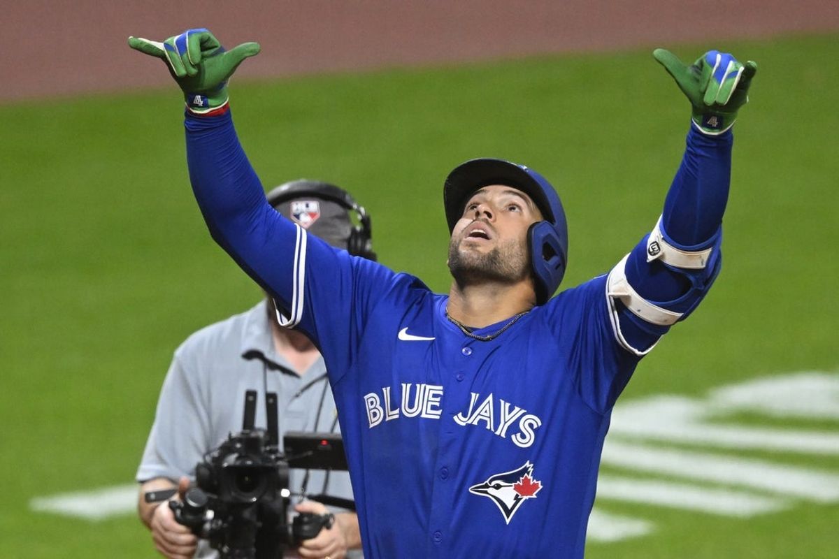 Jun 24, 2025; Cleveland, Ohio, USA; Toronto Blue Jays designated hitter George Springer (4) celebrates his grand slam in the eighth inning against the Cleveland Guardians at Progressive Field. Mandatory Credit: David Richard-Imagn Images