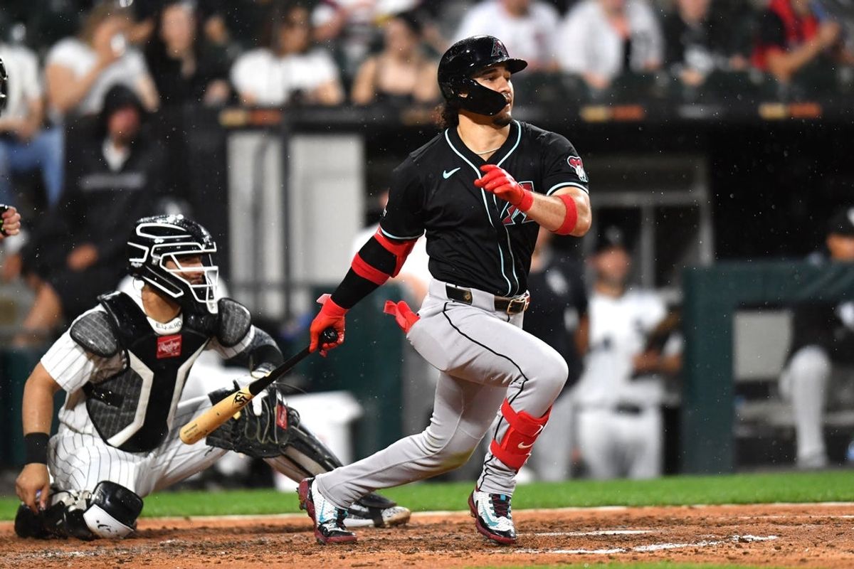 Jun 24, 2025; Chicago, Illinois, USA; Arizona Diamondbacks center fielder Alek Thomas (5) hits an RBI single during the seventh inning against the Chicago White Sox at Rate Field. Mandatory Credit: Patrick Gorski-Imagn Images