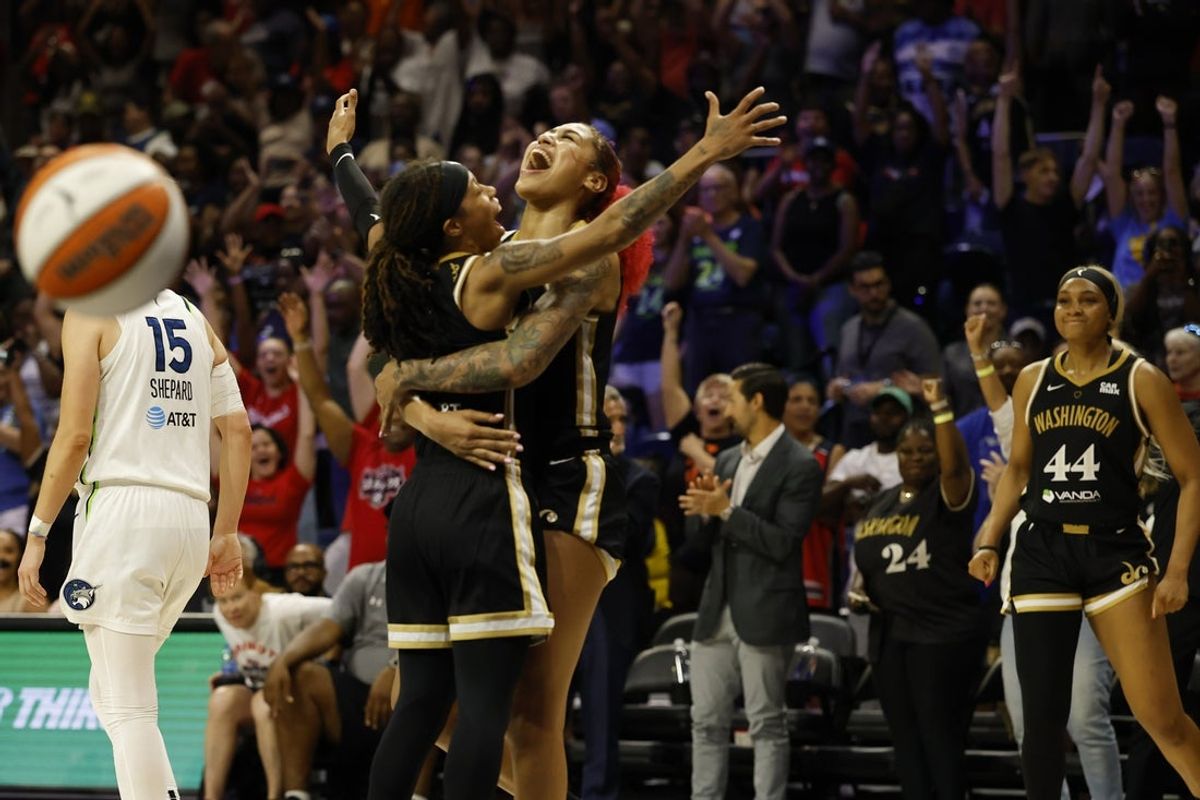 Jun 24, 2025; Washington, District of Columbia, USA; Washington Mystics guard Sug Sutton (1) celebrates with Washington Mystics forward Shakira Austin (0) after the final horn against the Minnesota Lynx at Entertainment & Sports Arena. Mandatory Credit: Geoff Burke-Imagn Images