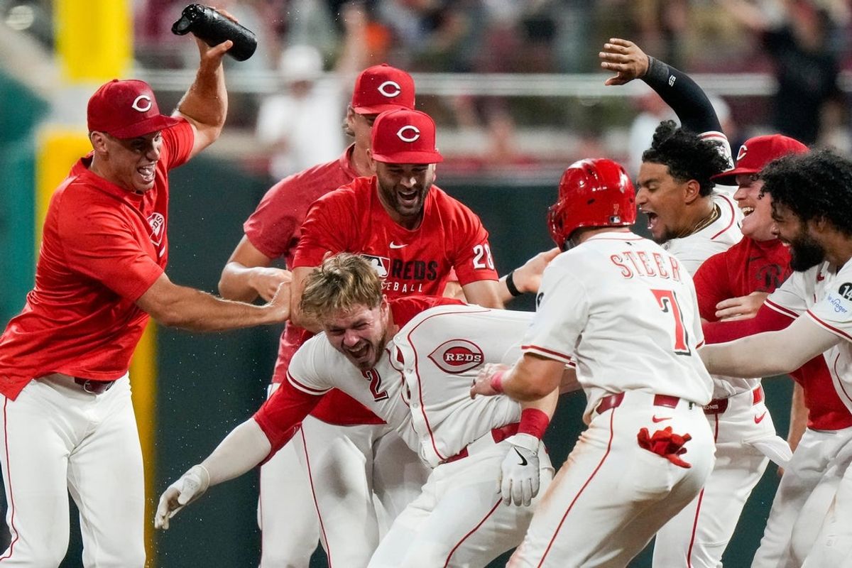 Cincinnati Reds pinch hitter Gavin Lux (2) hits a walk-off RBI line drive to score Elly De La Cruz from third base in the bottom of the 11th inning of the MLB interleague game between the Cincinnati Reds and the New York Yankees at Great American Ball Park in downtown Cincinnati on Tuesday, June 24, 2025. The Reds won 5-4 in 11 innings.