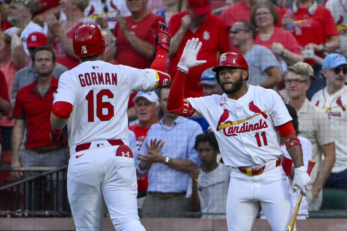 Jun 24, 2025; St. Louis, Missouri, USA;  St. Louis Cardinals designated hitter Nolan Gorman (16) is congratulated by center fielder Victor Scott II (11) after hitting a solo home run against the Chicago Cubs during the fourth inning at Busch Stadium. Mandatory Credit: Jeff Curry-Imagn Images