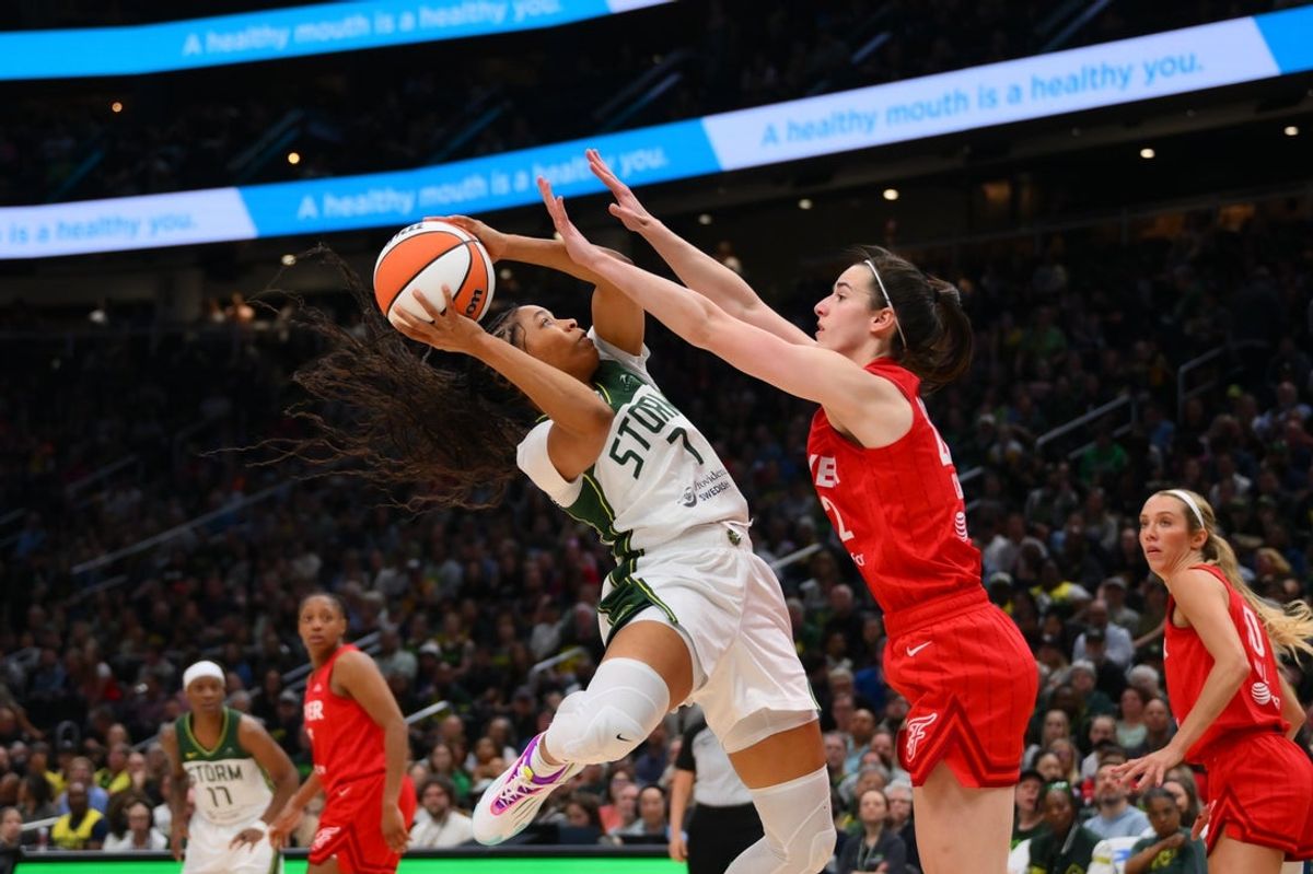 Jun 24, 2025; Seattle, Washington, USA; Seattle Storm guard Zia Cooke (7) shoots the ball while guarded by Indiana Fever guard Caitlin Clark (22) during the first half at Climate Pledge Arena. Mandatory Credit: Steven Bisig-Imagn Images