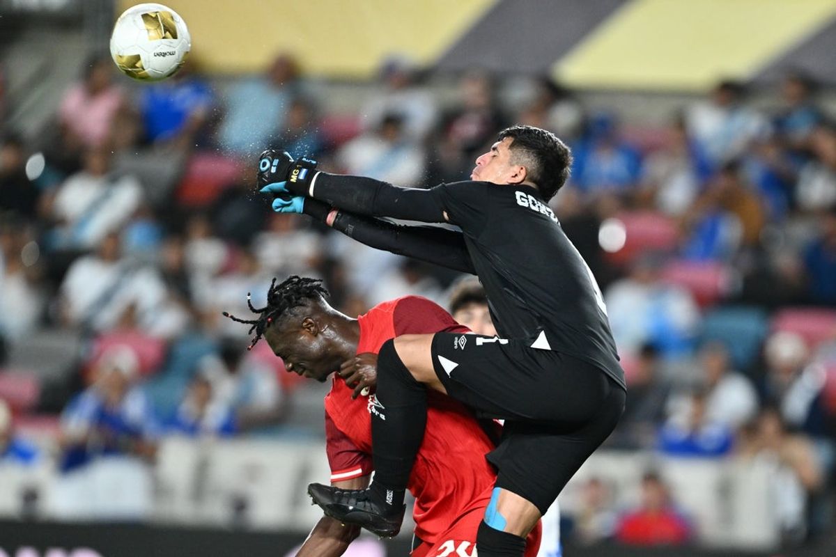 Jun 24, 2025; Houston, Texas, USA; El Salvador goalkeeper Mario Gonzalez (1) defended by the net as he collides with Canada forward Promise David (24) in the second half during a group stage match of the 2025 Gold Cup at Shell Energy Stadium. Mandatory Credit: Maria Lysaker-Imagn Images