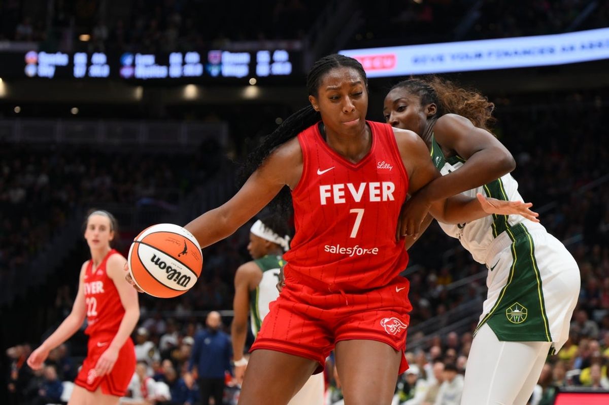 Jun 24, 2025; Seattle, Washington, USA; Indiana Fever forward Aliyah Boston (7) dribbles the ball while guarded by Seattle Storm forward Ezi Magbegor (13) during the second half at Climate Pledge Arena. Mandatory Credit: Steven Bisig-Imagn Images
