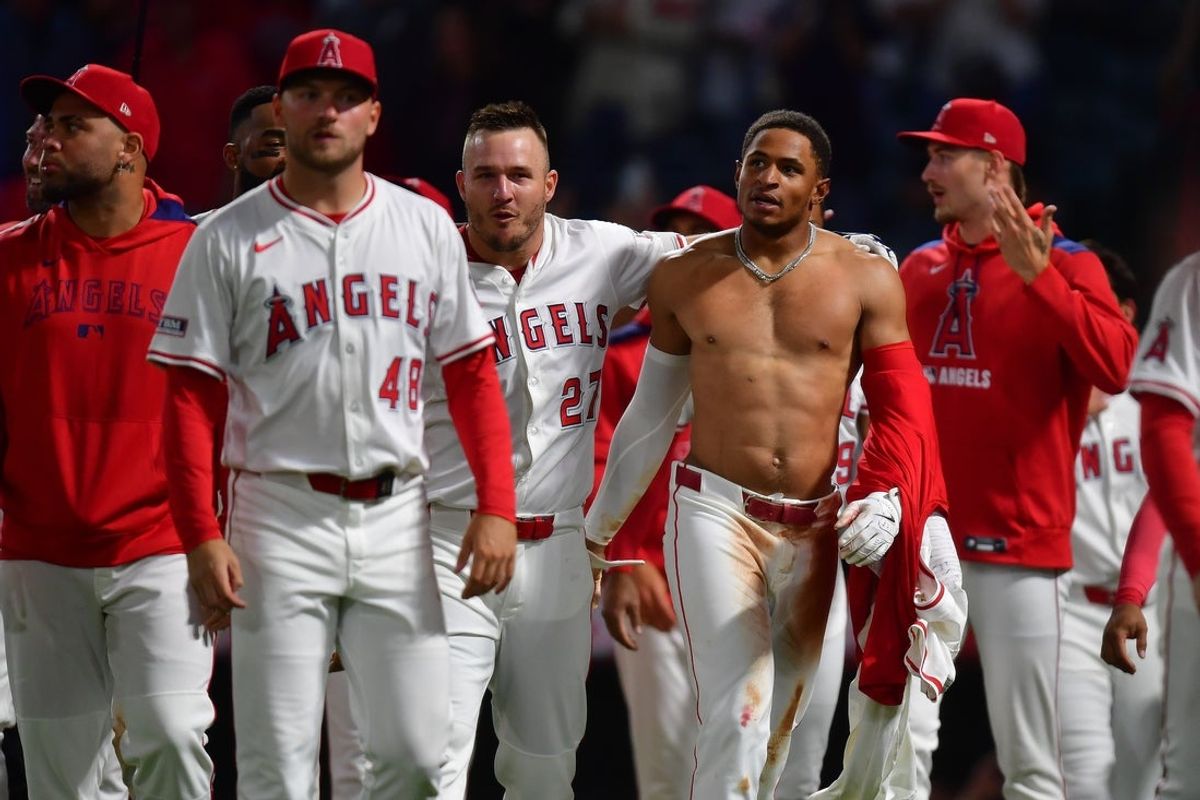 Jun 24, 2025; Anaheim, California, USA; Los Angeles Angels designated hitter Mike Trout (27) celebrates the two run walk off home run of second baseman Christian Moore (4) against the Boston Red Sox at Angel Stadium. Mandatory Credit: Gary A. Vasquez-Imagn Images