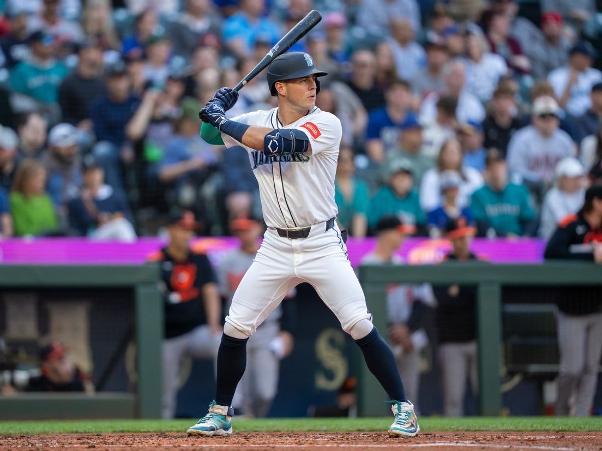 Jun 4, 2025; Seattle, Washington, USA;  Seattle Mariners right fielder Dylan Moore (25) waits for a pitch during an at-bat against the Baltimore Orioles at T-Mobile Park. Mandatory Credit: Stephen Brashear-Imagn Images