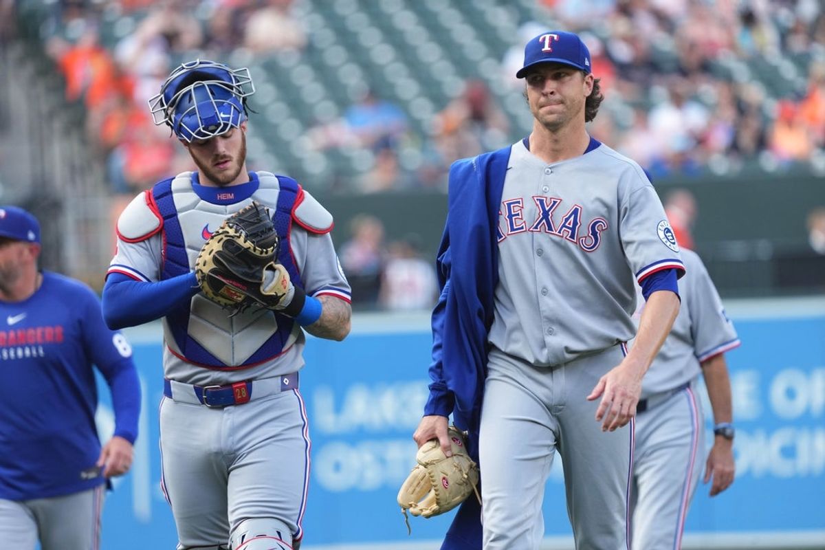 Jun 25, 2025; Baltimore, Maryland, USA; Texas Rangers pitcher Jacob DeGrom (right) and catcher Jonah Heim (left) prior to the game against the Baltimore Orioles at Oriole Park at Camden Yards. Mandatory Credit: Mitch Stringer-Imagn Images