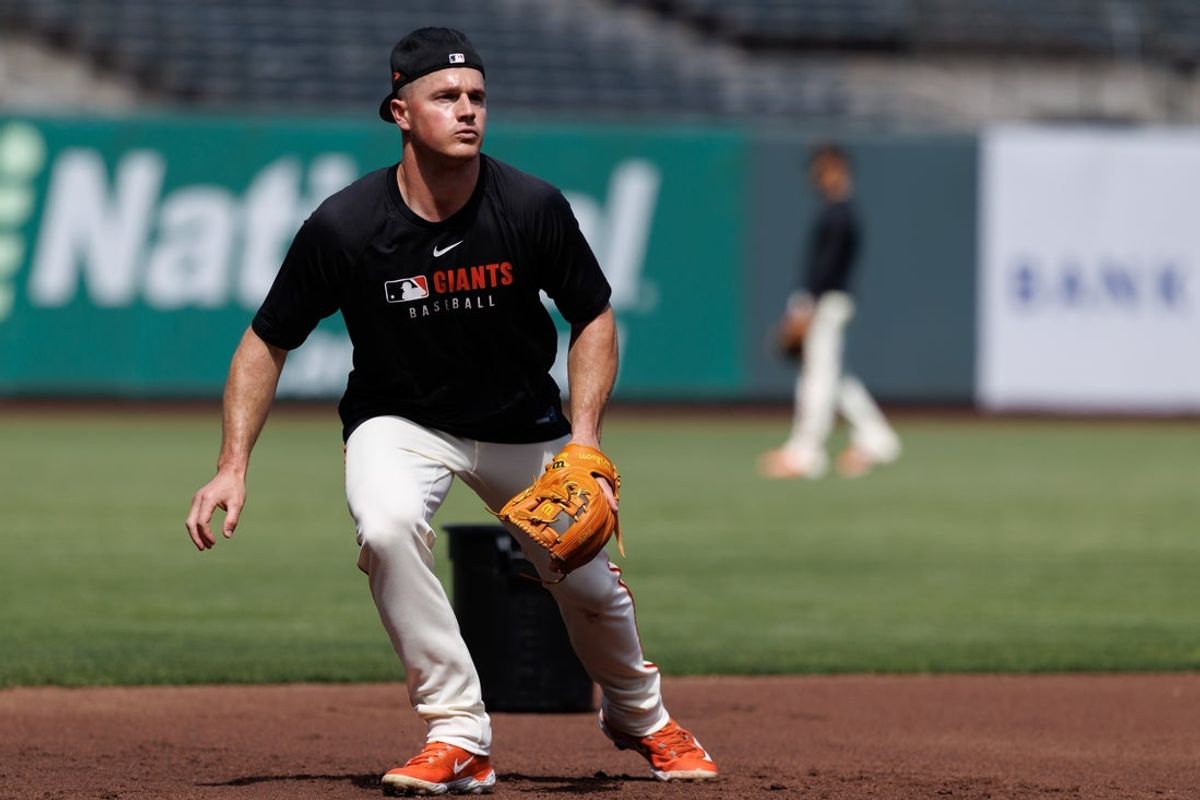 Jun 25, 2025; San Francisco, California, USA; San Francisco Giants third baseman Matt Chapman (26) fields grounders before the game against the Miami Marlins at Oracle Park. Mandatory Credit: Sergio Estrada-Imagn Images