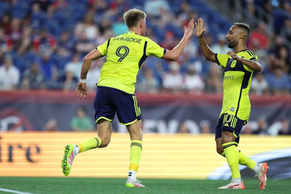 Jun 25, 2025; Foxborough, Massachusetts, USA; Nashville SC forward Sam Surridge (9) celebrates after scoring during the first half against the New England Revolution at Gillette Stadium. Mandatory Credit: Paul Rutherford-Imagn Images