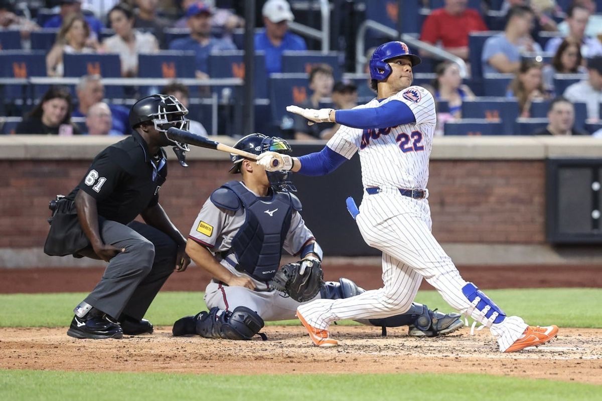 Jun 25, 2025; New York City, New York, USA;  New York Mets right fielder Juan Soto (22) hits a solo home run in the fourth inning against the Atlanta Braves at Citi Field. Mandatory Credit: Wendell Cruz-Imagn Images