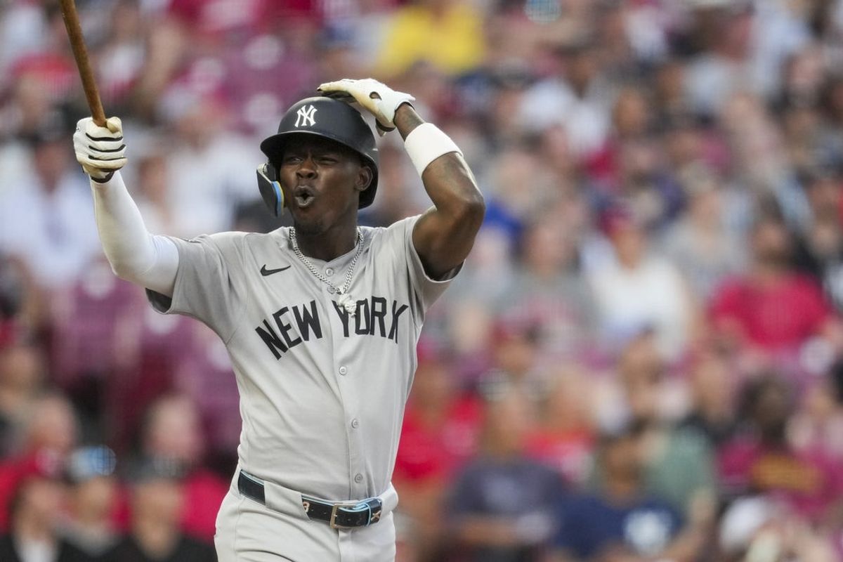 Jun 25, 2025; Cincinnati, Ohio, USA; New York Yankees second baseman Jazz Chisholm Jr. reacts to hitting a fly ball for an out with the bases loaded against the Cincinnati Reds in the fifth inning at Great American Ball Park. Mandatory Credit: Aaron Doster-Imagn Images