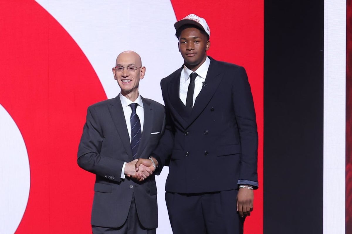 Jun 25, 2025; Brooklyn, NY, USA;  Derik Queen stands with NBA commissioner Adam Silver after being selected as the 13th pick by the Atlanta Hawks in the first round of the 2025 NBA Draft at Barclays Center. Mandatory Credit: Brad Penner-Imagn Images