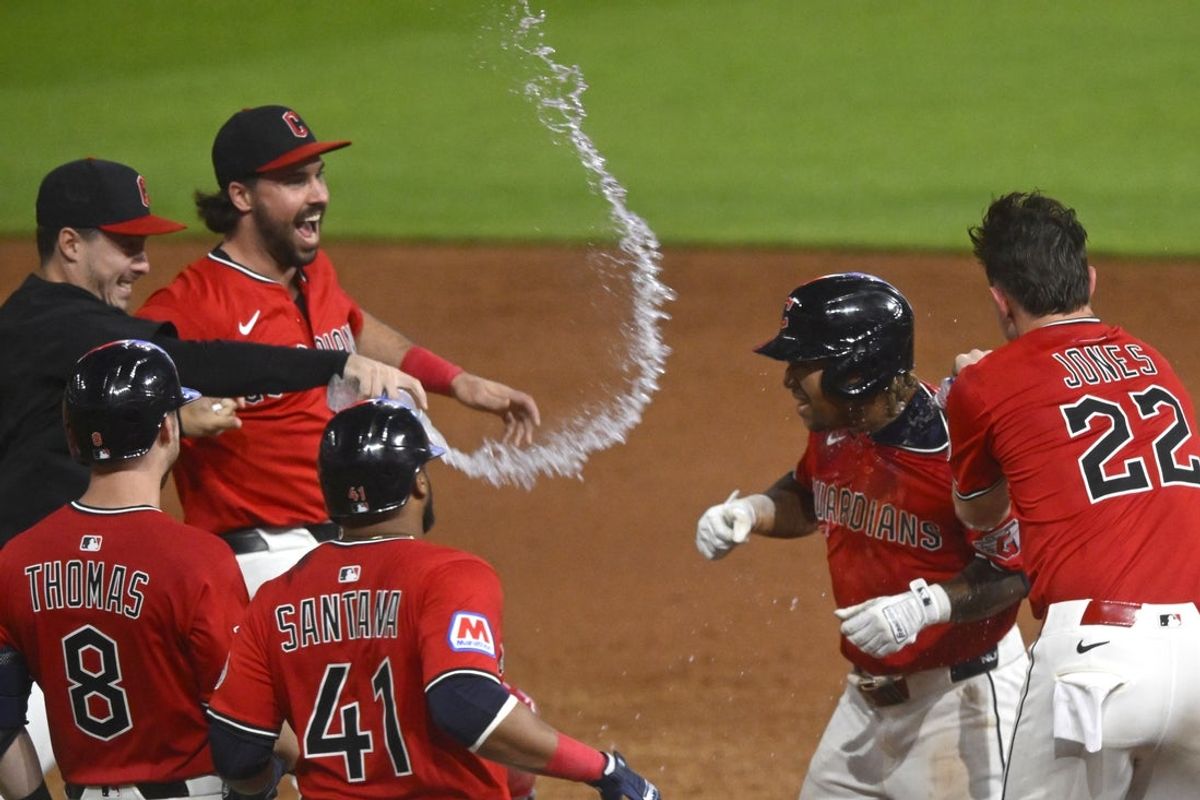 Jun 25, 2025; Cleveland, Ohio, USA; The Cleveland Guardians celebrate a game-winning single by third baseman Jose Ramirez (second from right) in the tenth inning against the Toronto Blue Jays at Progressive Field. Mandatory Credit: David Richard-Imagn Images