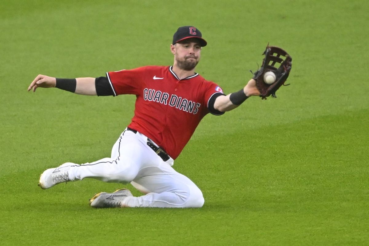 Jun 25, 2025; Cleveland, Ohio, USA; Cleveland Guardians center fielder Lane Thomas (8) makes a sliding catch in the eighth inning against the Toronto Blue Jays at Progressive Field. Mandatory Credit: David Richard-Imagn Images