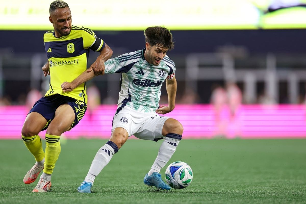 Jun 25, 2025; Foxborough, Massachusetts, USA; New England Revolution midfielder Carles Gil (10) possesses the ball during the second half against Nashville SC at Gillette Stadium. Mandatory Credit: Paul Rutherford-Imagn Images