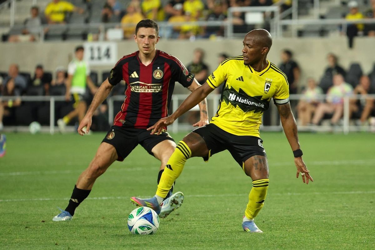 Jun 25, 2025; Columbus, Ohio, USA;  Columbus Crew midfielder Darlington Nagbe (6) steals the ball from Atlanta United midfielder Bartosz Slisz (99) during the second half at Lower.com Field. Mandatory Credit: Joseph Maiorana-Imagn Images