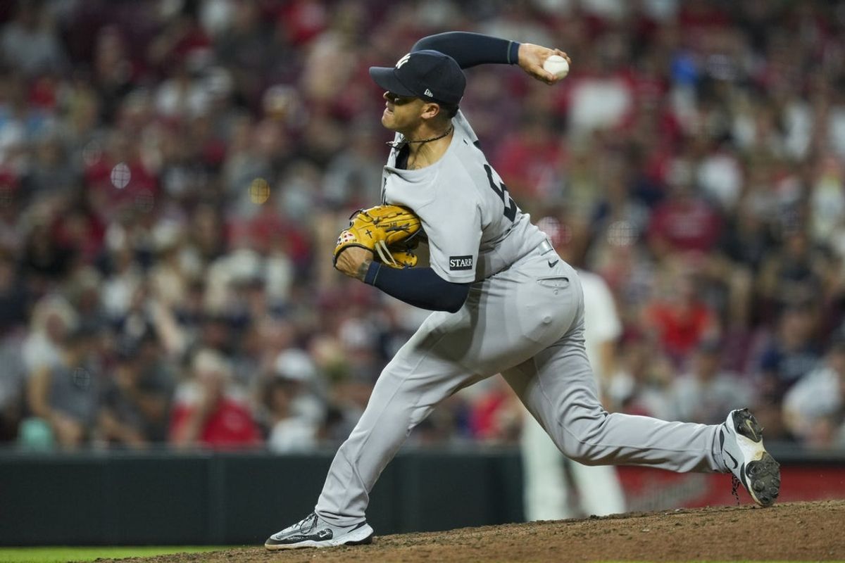 Jun 25, 2025; Cincinnati, Ohio, USA; New York Yankees pitcher Fernando Cruz throws against the Cincinnati Reds in the eighth inning at Great American Ball Park. Mandatory Credit: Aaron Doster-Imagn Images