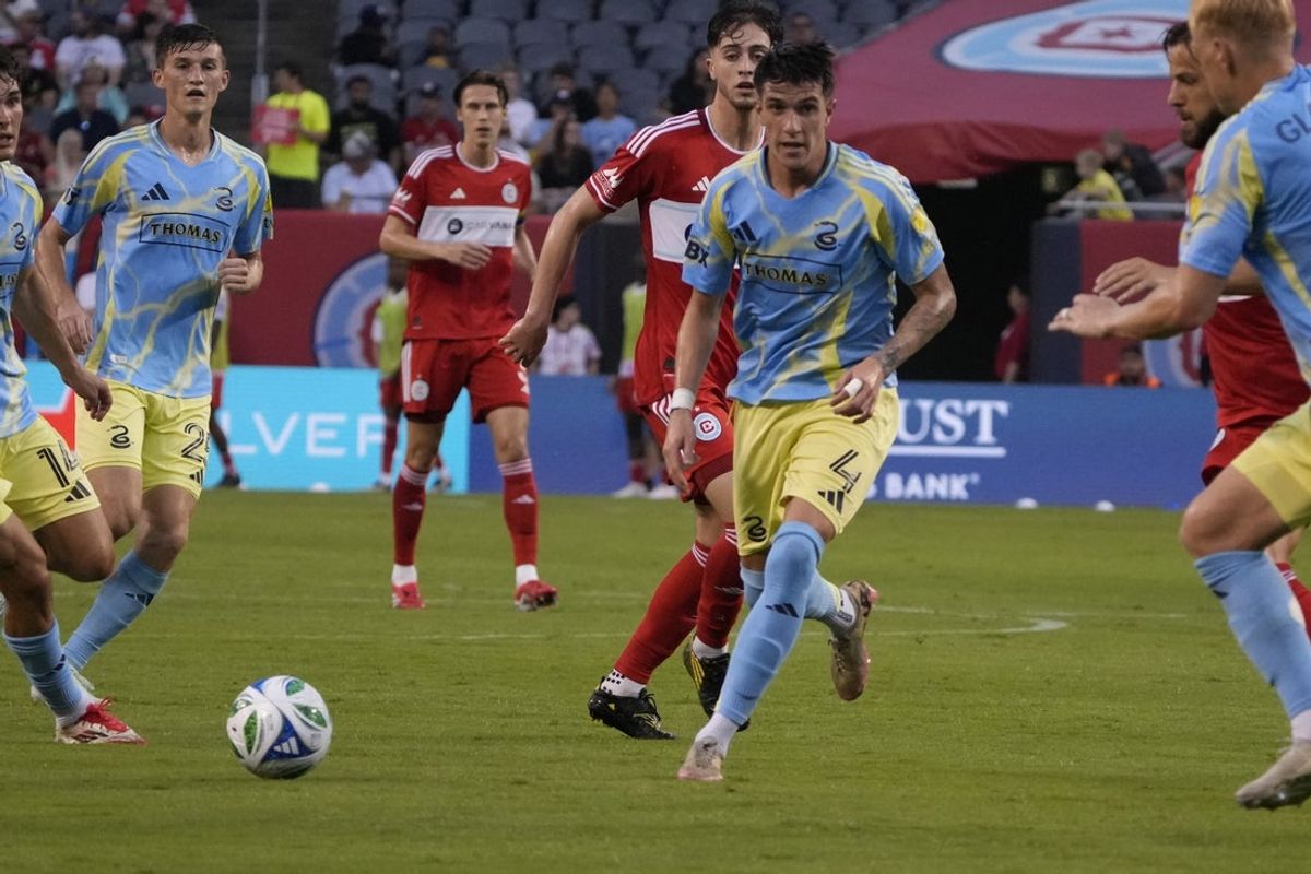 Jun 25, 2025; Chicago, Illinois, USA; Philadelphia Union midfielder Jovan Lukic (4) advances the ball against the Chicago Fire during the first half at Soldier Field. Mandatory Credit: David Banks-Imagn Images
