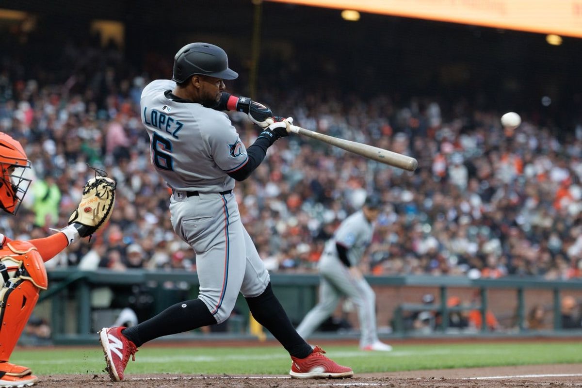 Jun 25, 2025; San Francisco, California, USA; Miami Marlins shortstop Otto Lopez (6) a hits a two run RBI double at during the fourth inning against the San Francisco Giants during the fourth inning at Oracle Park. Lopez was tagged out at third base. Mandatory Credit: Sergio Estrada-Imagn Images