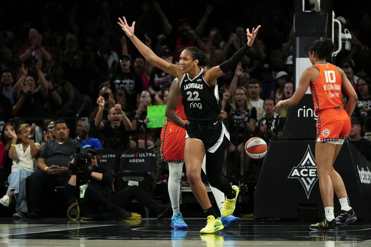 Jun 25, 2025; Las Vegas, Nevada, USA; Las Vegas Aces center A'ja Wilson (22) reacts after scoring against the Connecticut Sun during the first half of a WNBA basketball game at Michelob Ultra Arena. Mandatory Credit: Lucas Peltier-Imagn Images