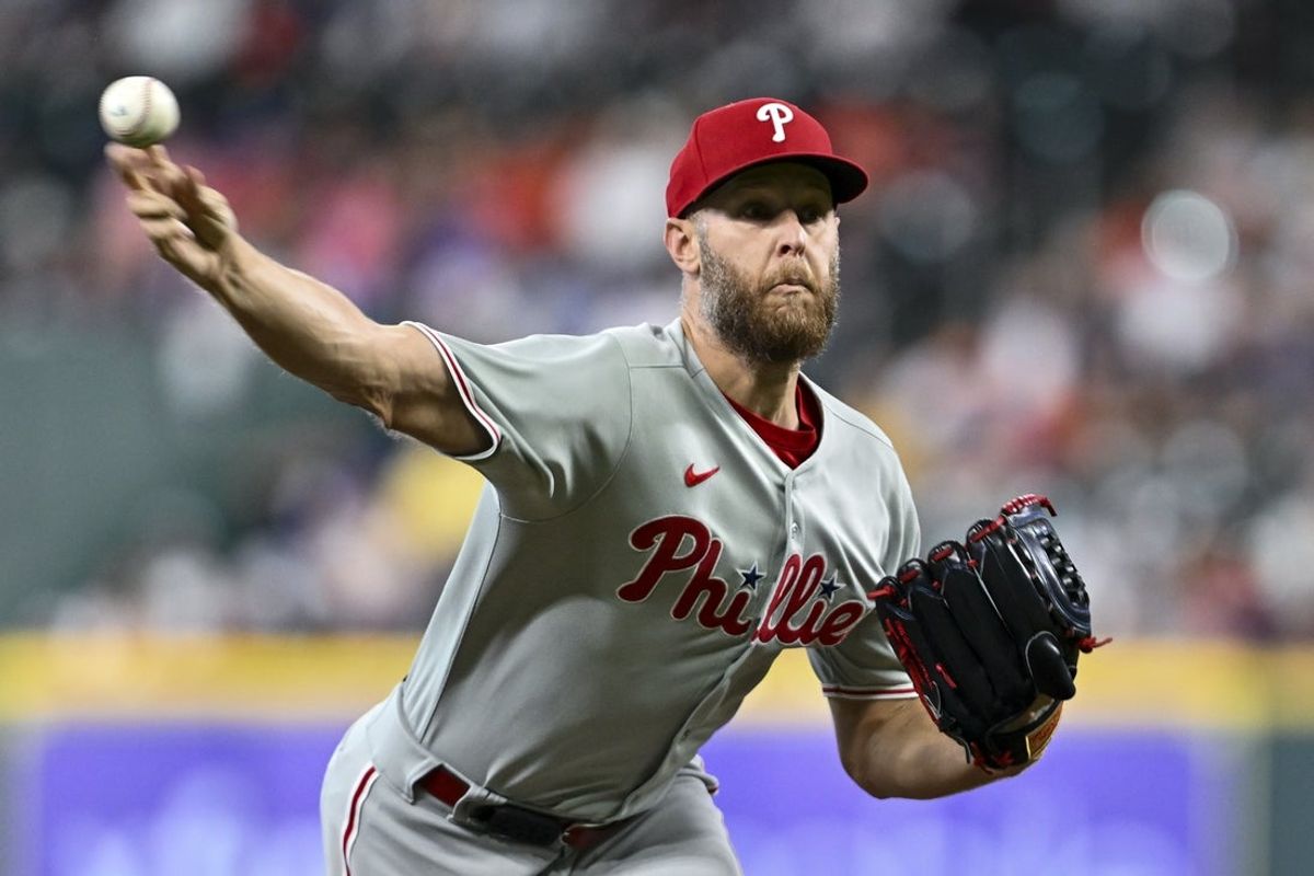 Jun 25, 2025; Houston, Texas, USA; Philadelphia Phillies starting pitcher Zack Wheeler (45) delivers a pitch against the Houston Astros in the first inning at Daikin Park. Mandatory Credit: Maria Lysaker-Imagn Images