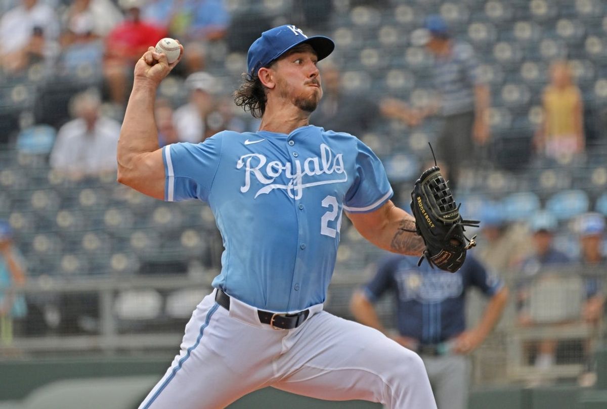 Jun 26, 2025; Kansas City, Missouri, USA;  Kansas City Royals starting pitcher Michael Lorenzen (24) throws a pitch in the first inning against the Tampa Bay Rays at Kauffman Stadium. Mandatory Credit: Peter Aiken-Imagn Images