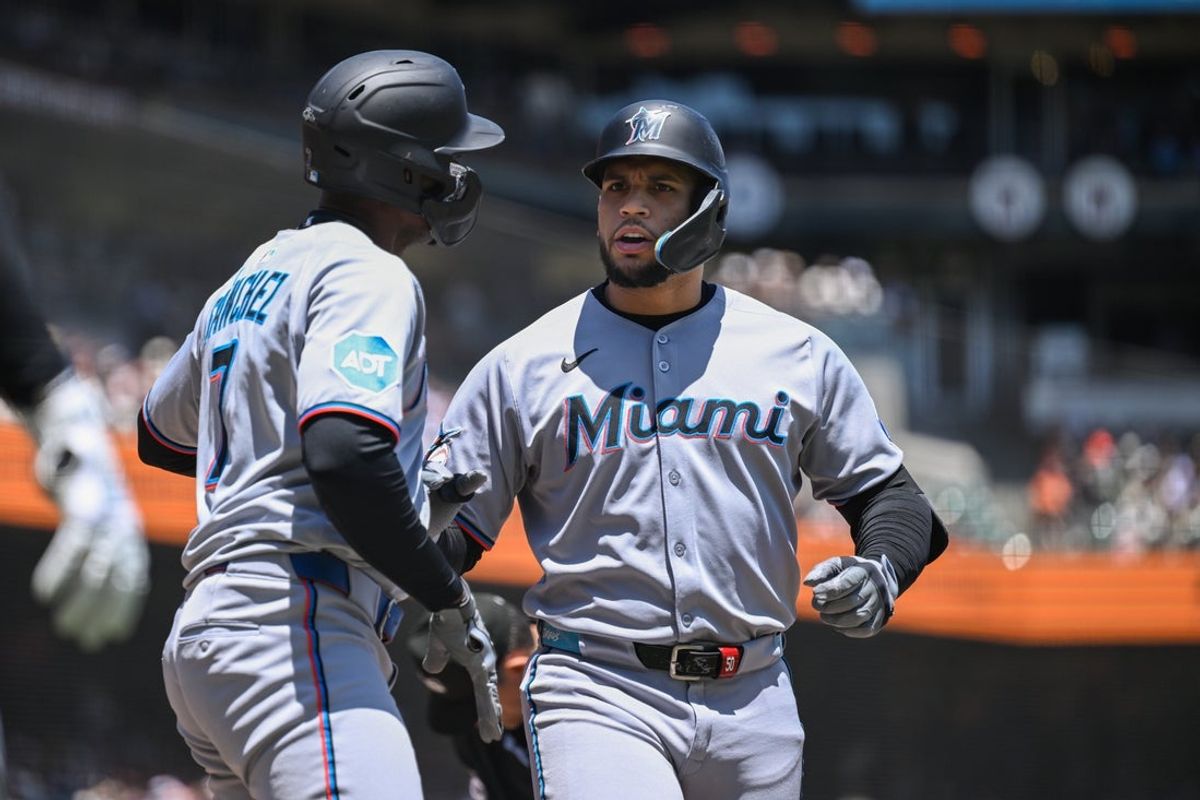 Jun 26, 2025; San Francisco, California, USA;  Miami Marlins designated hitter Agustin Ramirez (50) celebrates with right fielder Jesus Sanchez (7) after hitting a two-run home run against the San Francisco Giants in the third inning at Oracle Park. Mandatory Credit: Eakin Howard-Imagn Images