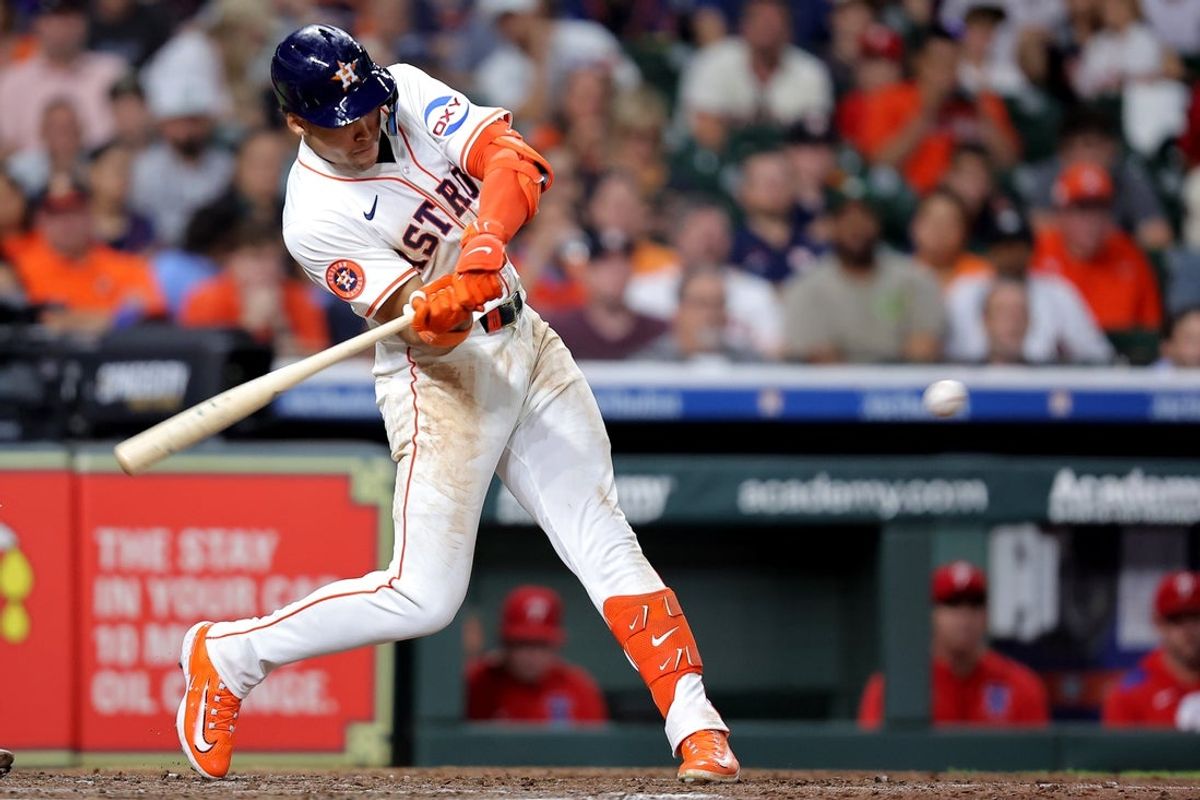 Jun 26, 2025; Houston, Texas, USA; Houston Astros right fielder Cam Smith (11) hits an RBI single against the Philadelphia Phillies during the eighth inning at Daikin Park. Mandatory Credit: Erik Williams-Imagn Images