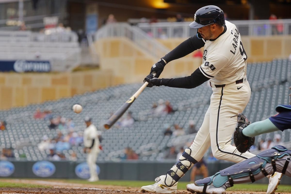 Jun 26, 2025; Minneapolis, Minnesota, USA; Minnesota Twins designated hitter Trevor Larnach (9) hits a two run home run against the Seattle Mariners in the fifth inning at Target Field. Mandatory Credit: Bruce Kluckhohn-Imagn Images