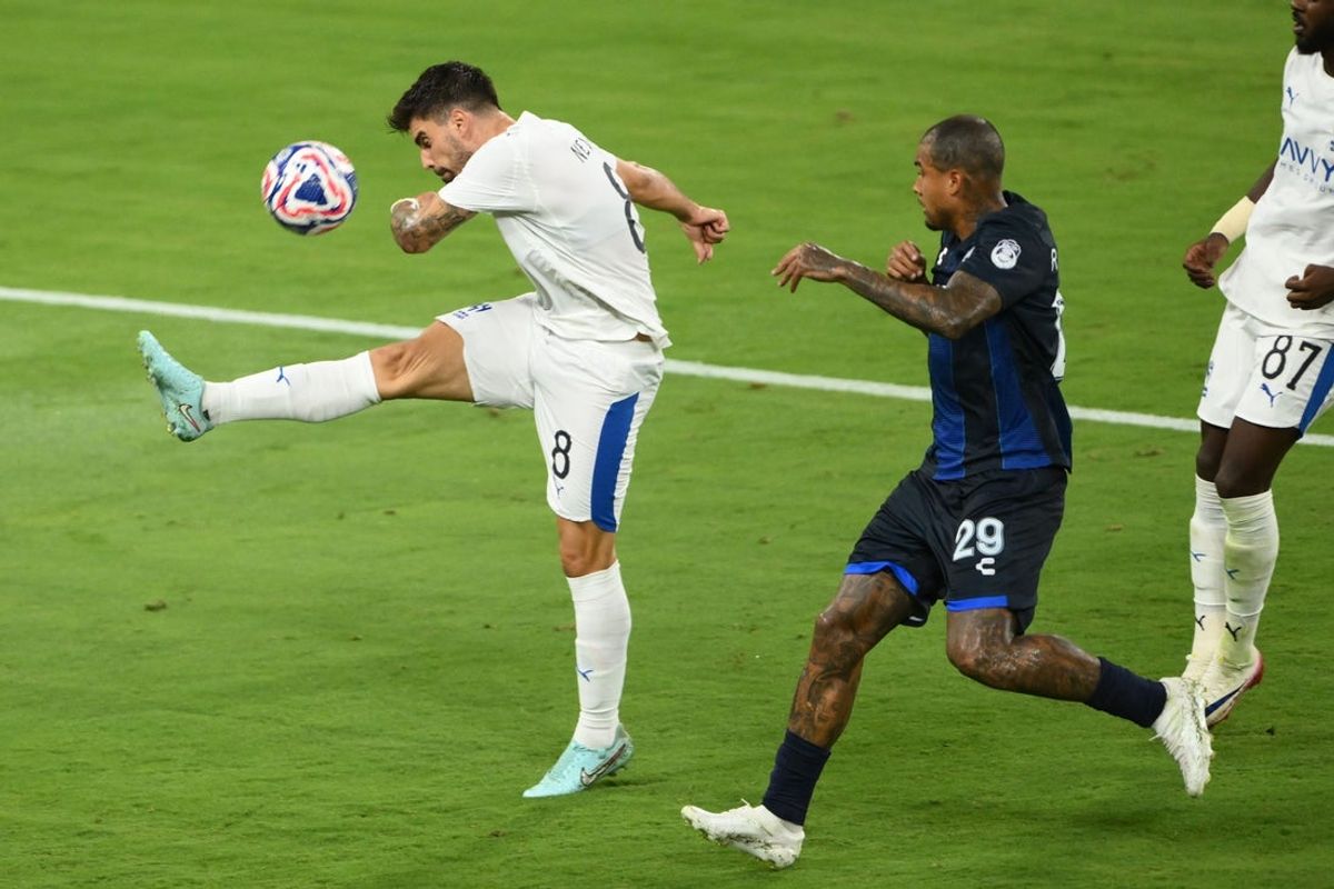 Jun 26, 2025; Nashville, Tennessee, USA; Al Hilal FC midfielder Ruben Neves (8) clears the ball from CF Pachuca forward Kenedy (29) during a group stage match of the 2025 FIFA Club World Cup at GEODIS Park. Mandatory Credit: Steve Roberts-Imagn Images