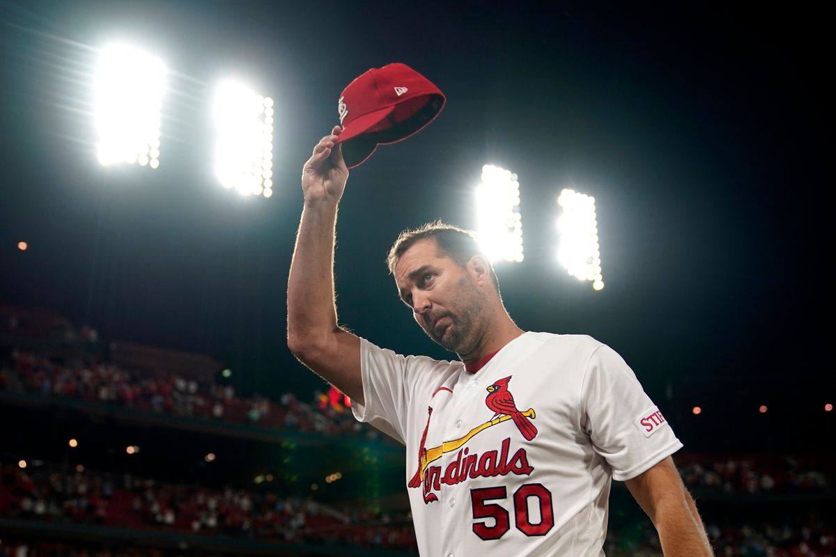 St. Louis Cardinals starting pitcher Adam Wainwright tips his cap after earning his 200th career win