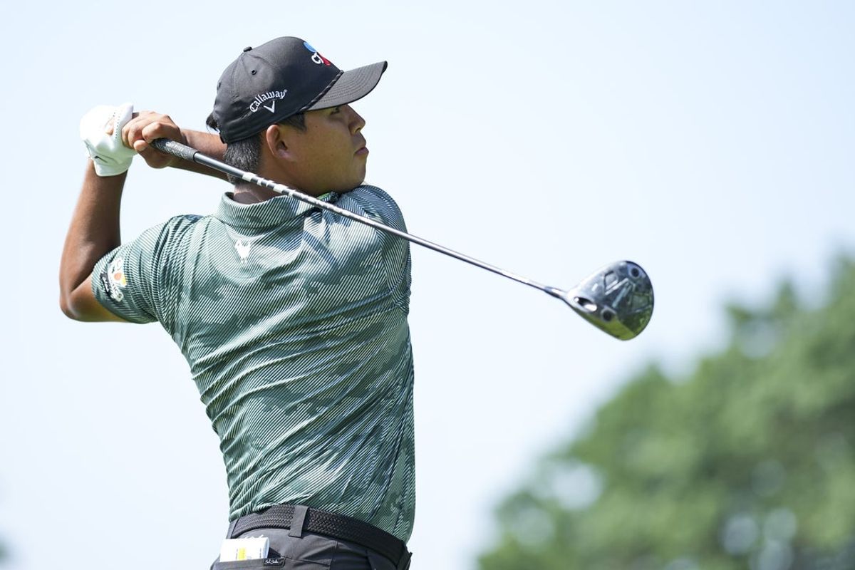 Jun 27, 2025; Detroit, Michigan, USA; Si Woo Kim plays his shot from the 13th tee during the second round of the Rocket Mortgage Classic golf tournament. Mandatory Credit: Aaron Doster-Imagn Images