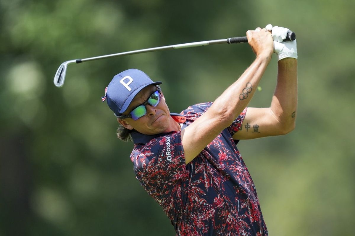 Jun 27, 2025; Detroit, Michigan, USA; Rickie Fowler plays his shot from the ninth tee during the second round of the Rocket Mortgage Classic golf tournament. Mandatory Credit: Aaron Doster-Imagn Images