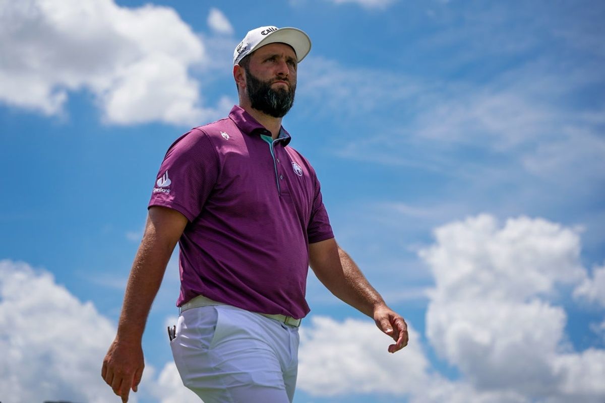 Jun 27, 2025; Carrollton, Texas, USA; Jon Rahm walks from the 16th tee during the first round of the LIV Golf Dallas golf tournament at Maridoe Golf Club. Mandatory Credit: Raymond Carlin III-Imagn Images