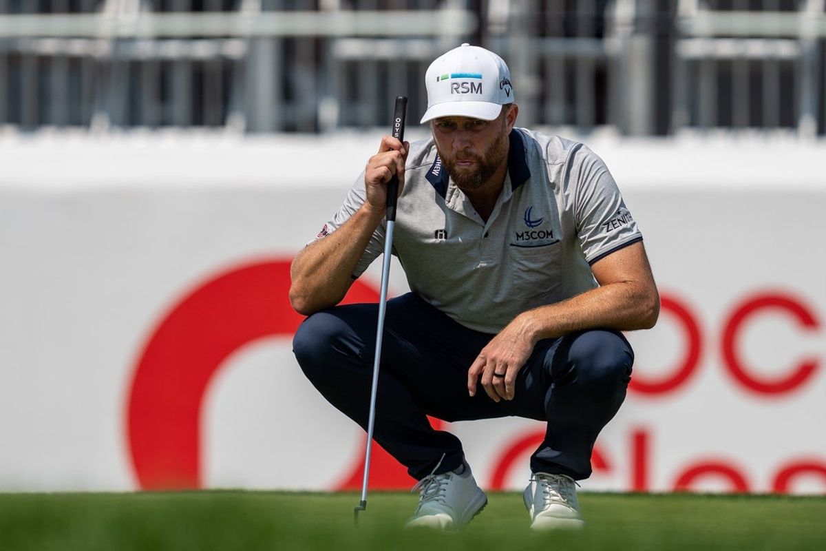 PGA Tour pro Chris Kirk reads his line during the second round of the Rocket Classic at the Detroit Golf Club in Detroit on Friday, June 27, 2025.