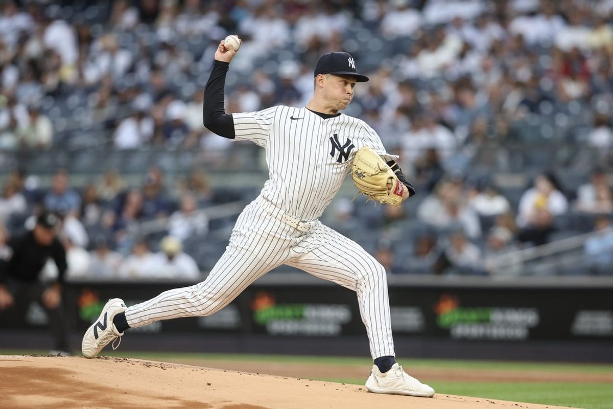 Jun 27, 2025; Bronx, New York, USA;  New York Yankees starting pitcher Will Warren (98) pitches in the first inning against the Athletics at Yankee Stadium. Mandatory Credit: Wendell Cruz-Imagn Images
