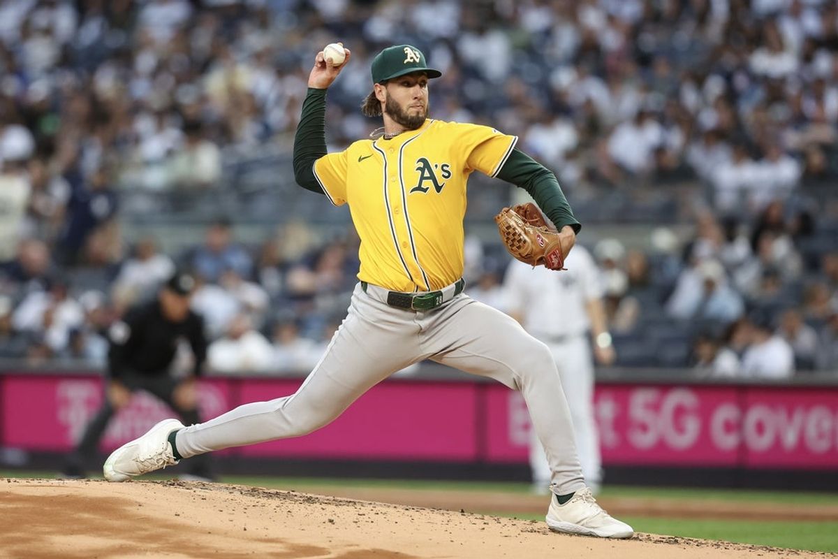 Jun 27, 2025; Bronx, New York, USA;  Athletics starting pitcher Mitch Spence (28) pitches in the first inning against the New York Yankees at Yankee Stadium. Mandatory Credit: Wendell Cruz-Imagn Images