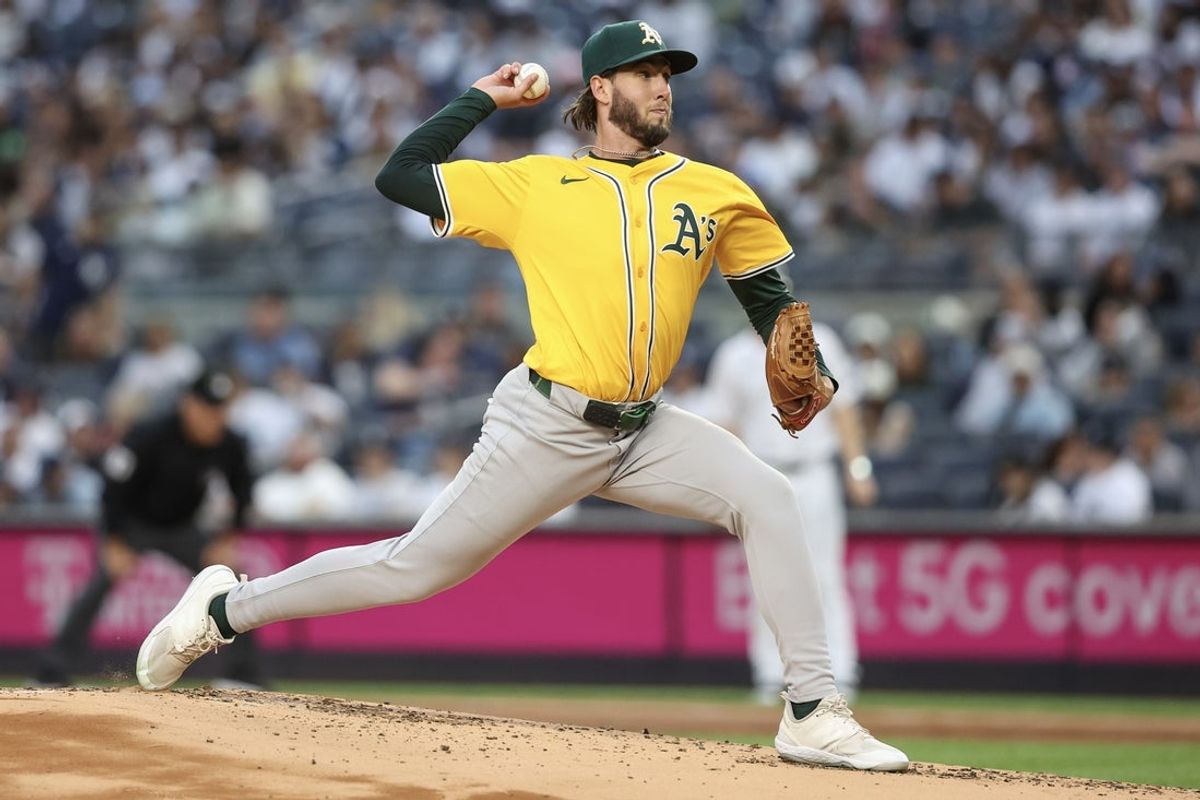 Jun 27, 2025; Bronx, New York, USA;  Athletics starting pitcher Mitch Spence (28) pitches in the first inning against the New York Yankees at Yankee Stadium. Mandatory Credit: Wendell Cruz-Imagn Images