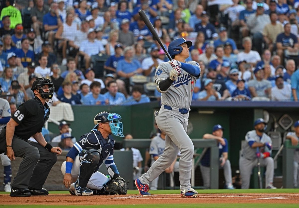 Jun 27, 2025; Kansas City, Missouri, USA; Los Angeles Dodgers designated hitter Shohei Ohtani (17) hits a solo home run in the first inning against the Kansas City Royals at Kauffman Stadium. Mandatory Credit: Peter Aiken-Imagn Images