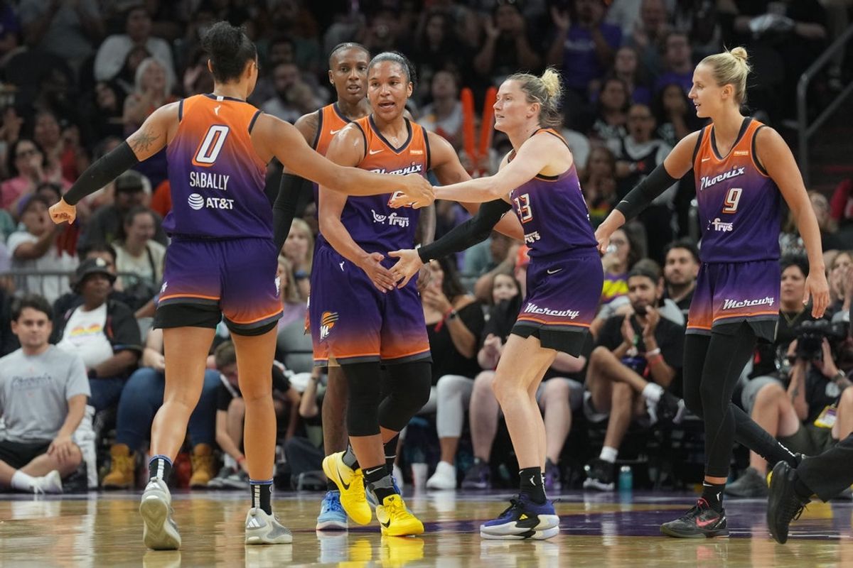 Jun 27, 2025; Phoenix, Arizona, USA; Phoenix Mercury players celebrate against the New York Liberty during the second half at Footprint Center. Mandatory Credit: Joe Camporeale-Imagn Images