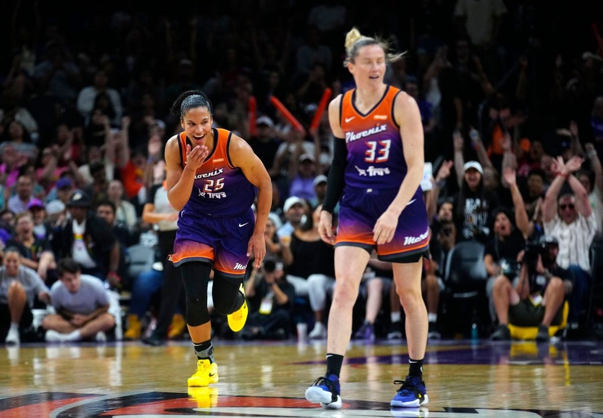 Mercury forward Alyssa Thomas (25) laughs after a crossover three-pointer from teammate Sami Whitcomb (33) against the Liberty during a game at PHX Arena in Phoenix, on June 27, 2025.