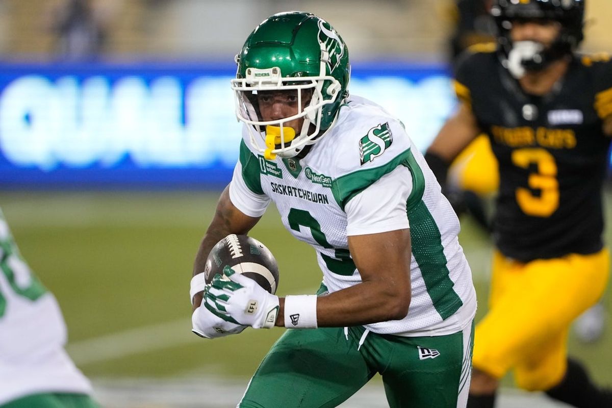 Jun 14, 2025; Hamilton, Ontario, Canada; Saskatchewan Roughriders wide receiver KeeSean Johnson (3) runs with the football after a pass reception against the Hamilton Tiger-Cats at Hamilton Stadium. Mandatory Credit: John E. Sokolowski-Imagn Images