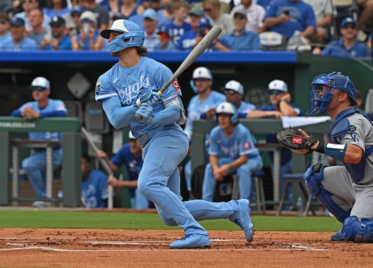 Jun 28, 2025; Kansas City, Missouri, USA;  Kansas City Royals designated hitter Bobby Witt Jr. (7) singles in the first inning against the Los Angeles Dodgers at Kauffman Stadium. Mandatory Credit: Peter Aiken-Imagn Images