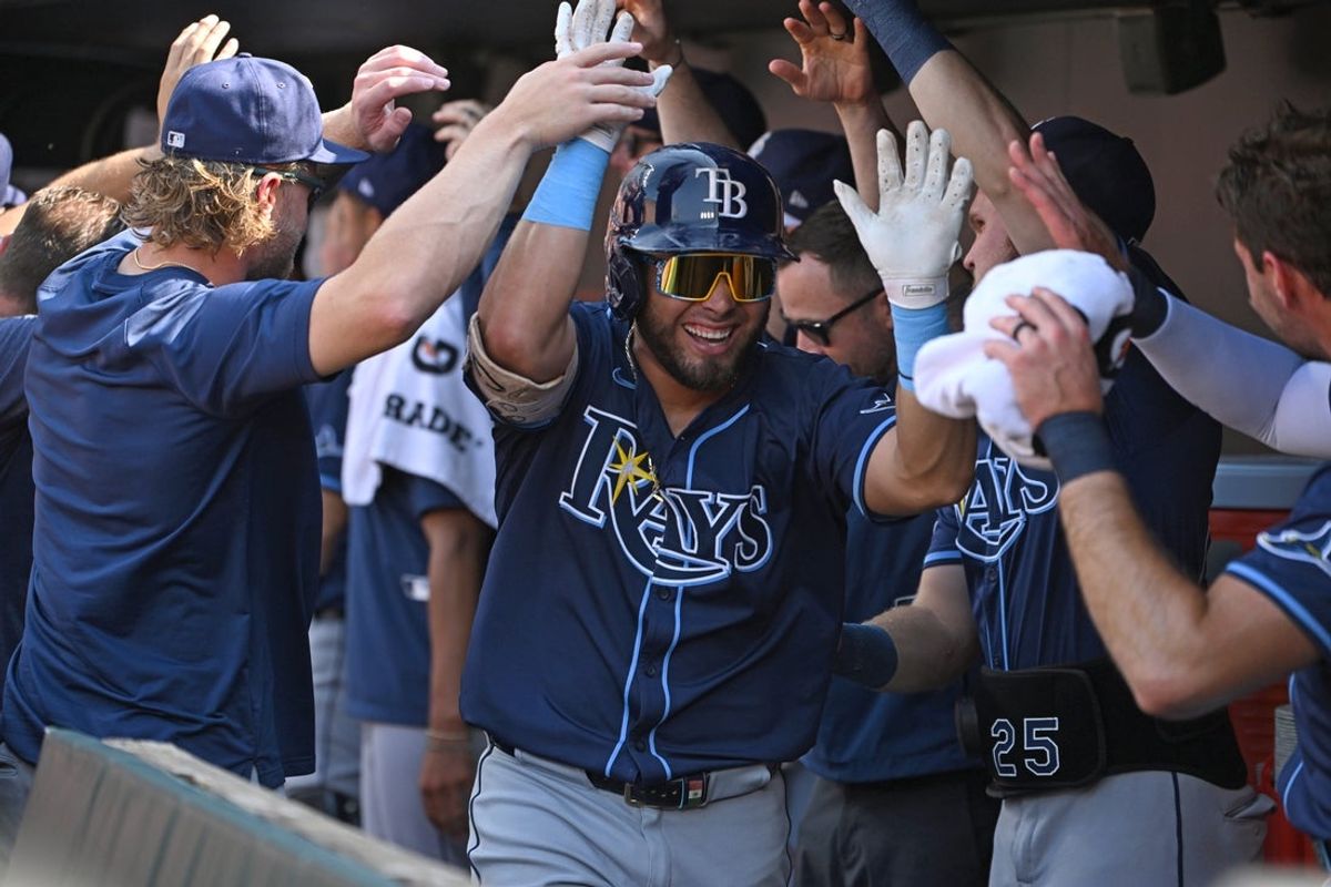 Jun 28, 2025; Baltimore, Maryland, USA; Tampa Bay Rays first baseman Jonathan Aranda (62) celebrates in the dugout after hitting a home run against the Baltimore Orioles during the first inning at Oriole Park at Camden Yards. Mandatory Credit: Rafael Suanes-Imagn Images