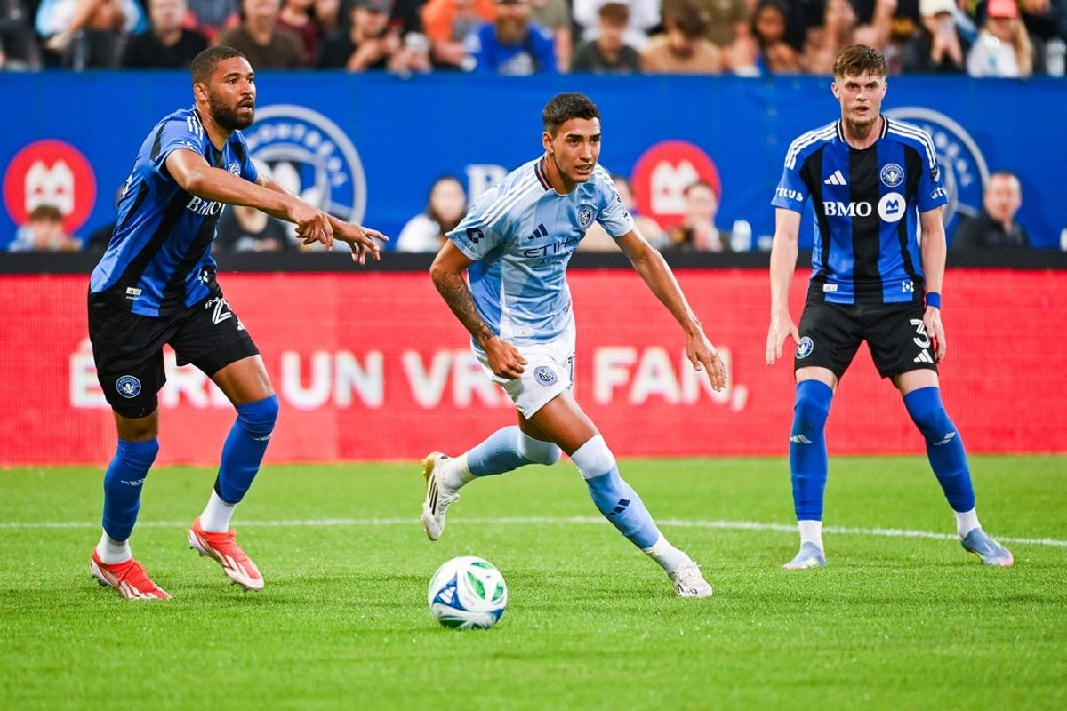 Jun 28, 2025; Montreal, Province of Quebec, CAN; CF Montreal defender George Campbell (24) defends the ball against New York City FC forward Julian Fernandez (11) during the first half at Saputo Stadium. Mandatory Credit: David Kirouac-Imagn Images