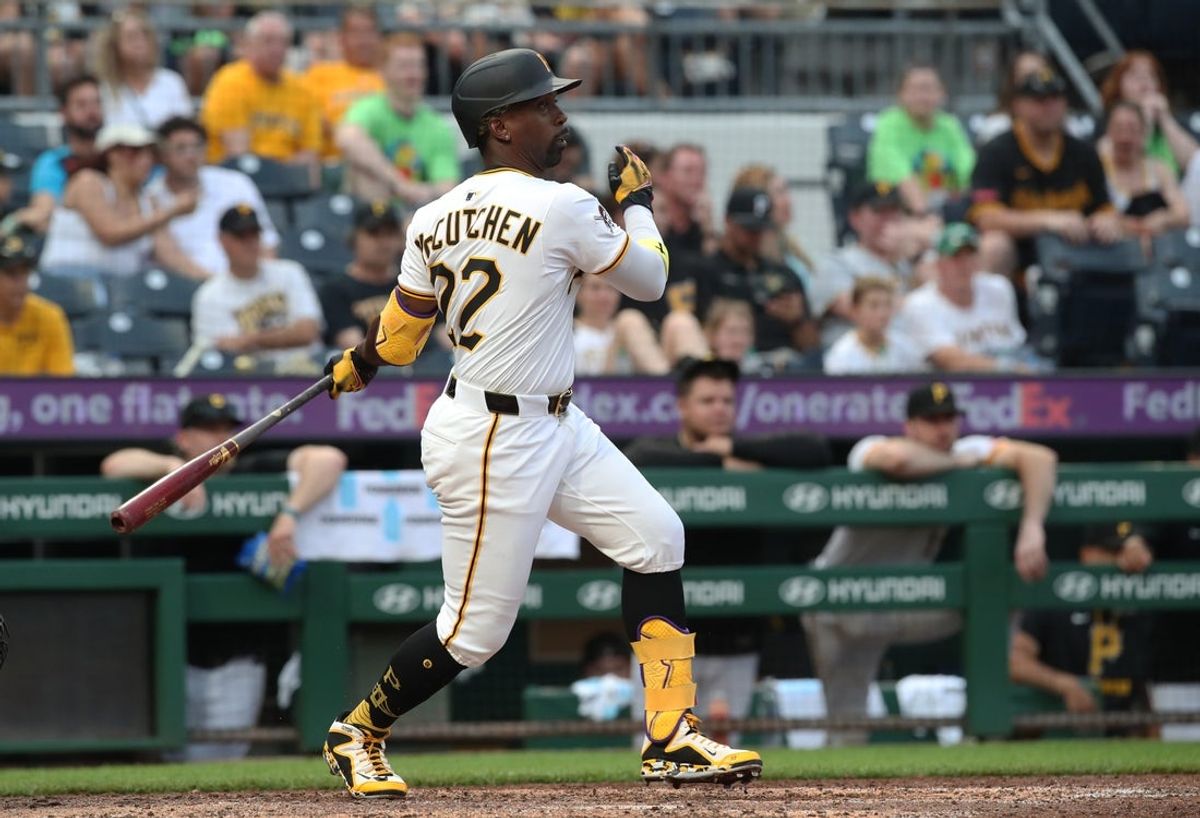 Jun 28, 2025; Pittsburgh, Pennsylvania, USA; Pittsburgh Pirates designated hitter Andrew McCutchen (22) hits a two run single against the New York Mets during the eighth inning at PNC Park. Mandatory Credit: Charles LeClaire-Imagn Images