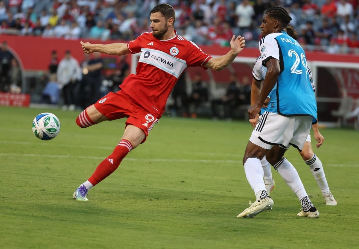 Jun 28, 2025; Chicago, Illinois, USA; Chicago Fire forward Hugo Cuypers (9) and Charlotte FC defender Adilson Malanda (29) battle for control of the ball during the first half at Soldier Field. Mandatory Credit: Talia Sprague-Imagn Images